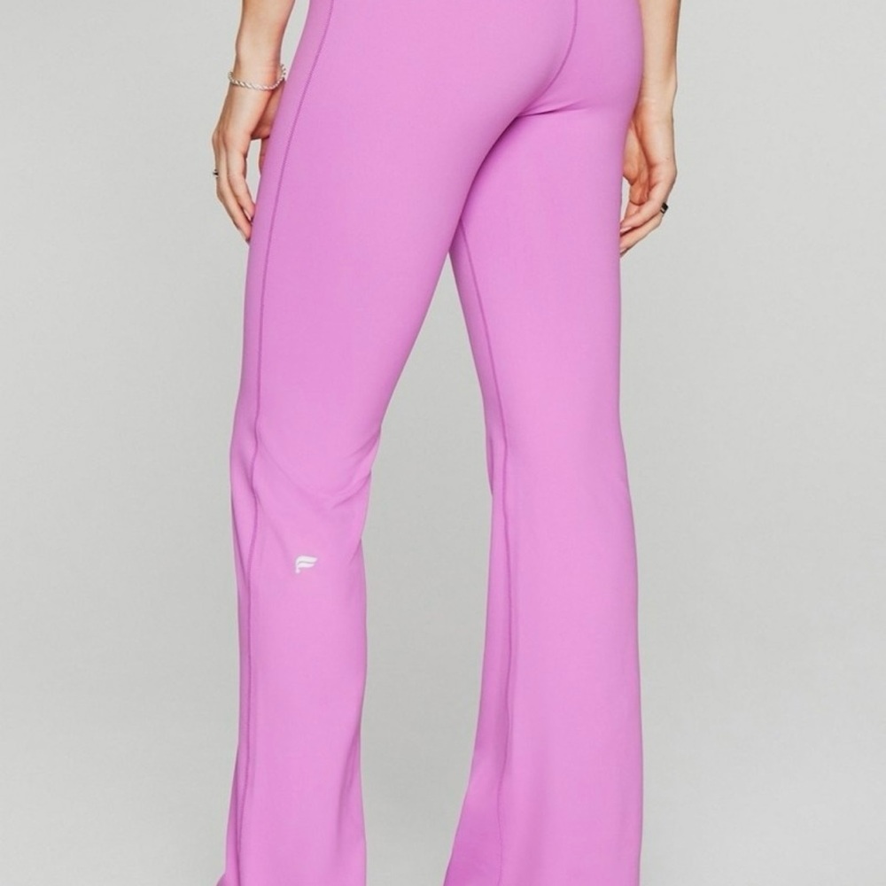 Fabletics High-Rise Flare Leggings in Bright Pink